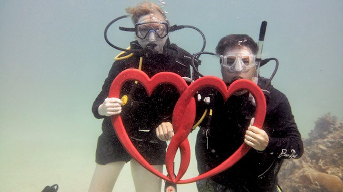4x cancer survivor Marnie Cervenka with her husband Greg, scuba diving on their 25th anniversary