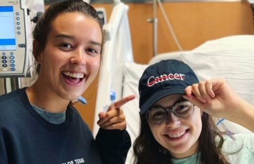 Taylor Fradella-Doucet (right) is pictured with her sister after her surgery in July 2019