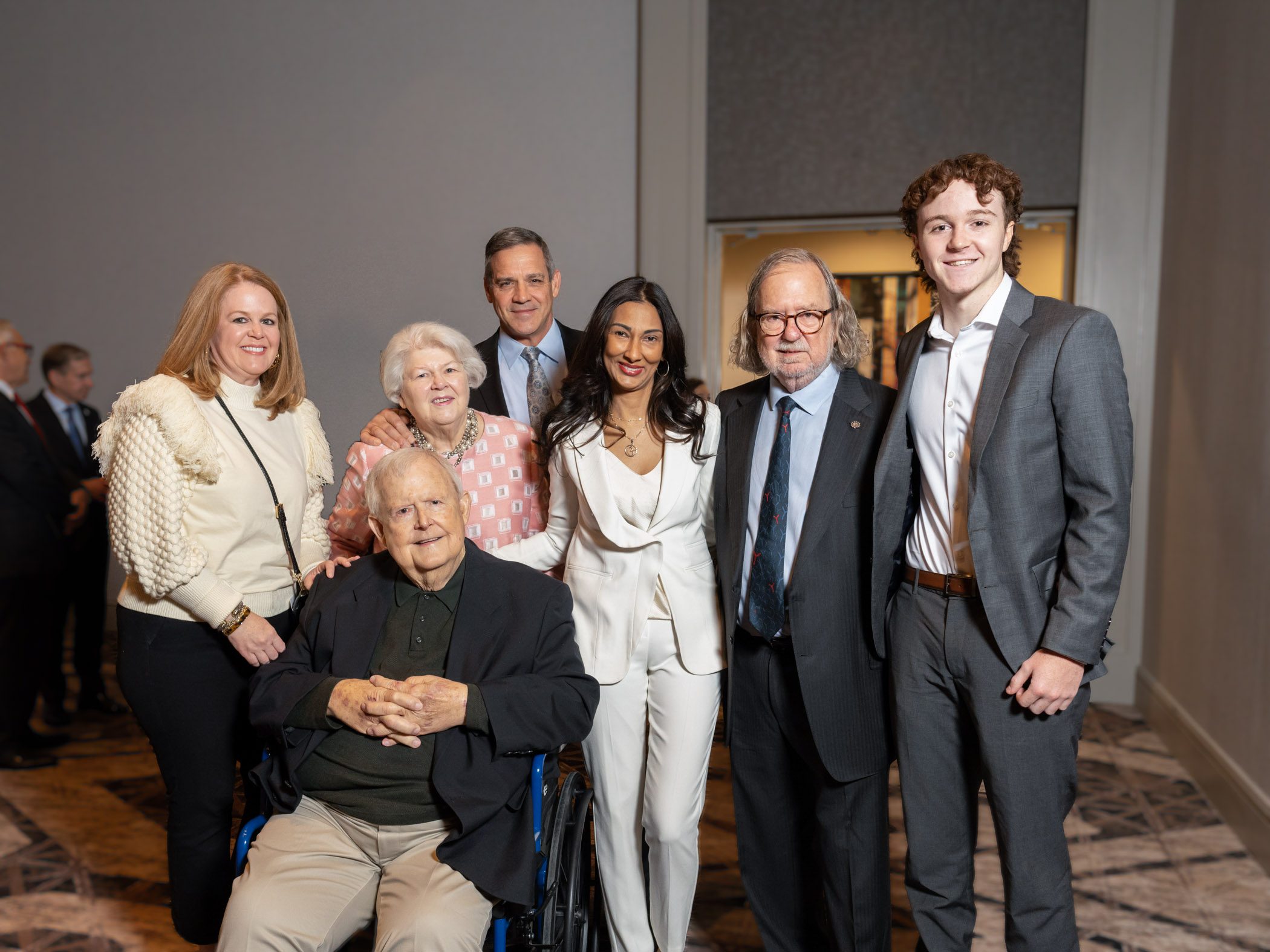 Drs. Allison and Sharma pose for a photo with Sam Gee and his family at “A Conversation With A Living Legend” in San Antonio on Nov. 18, 2022. From left to right: Ashley Gee, Bill Taff, Suzan Taff, Foster Sinclair, Dr. Padmanee Sharma, Dr. James P. Allison, Sam Gee.
