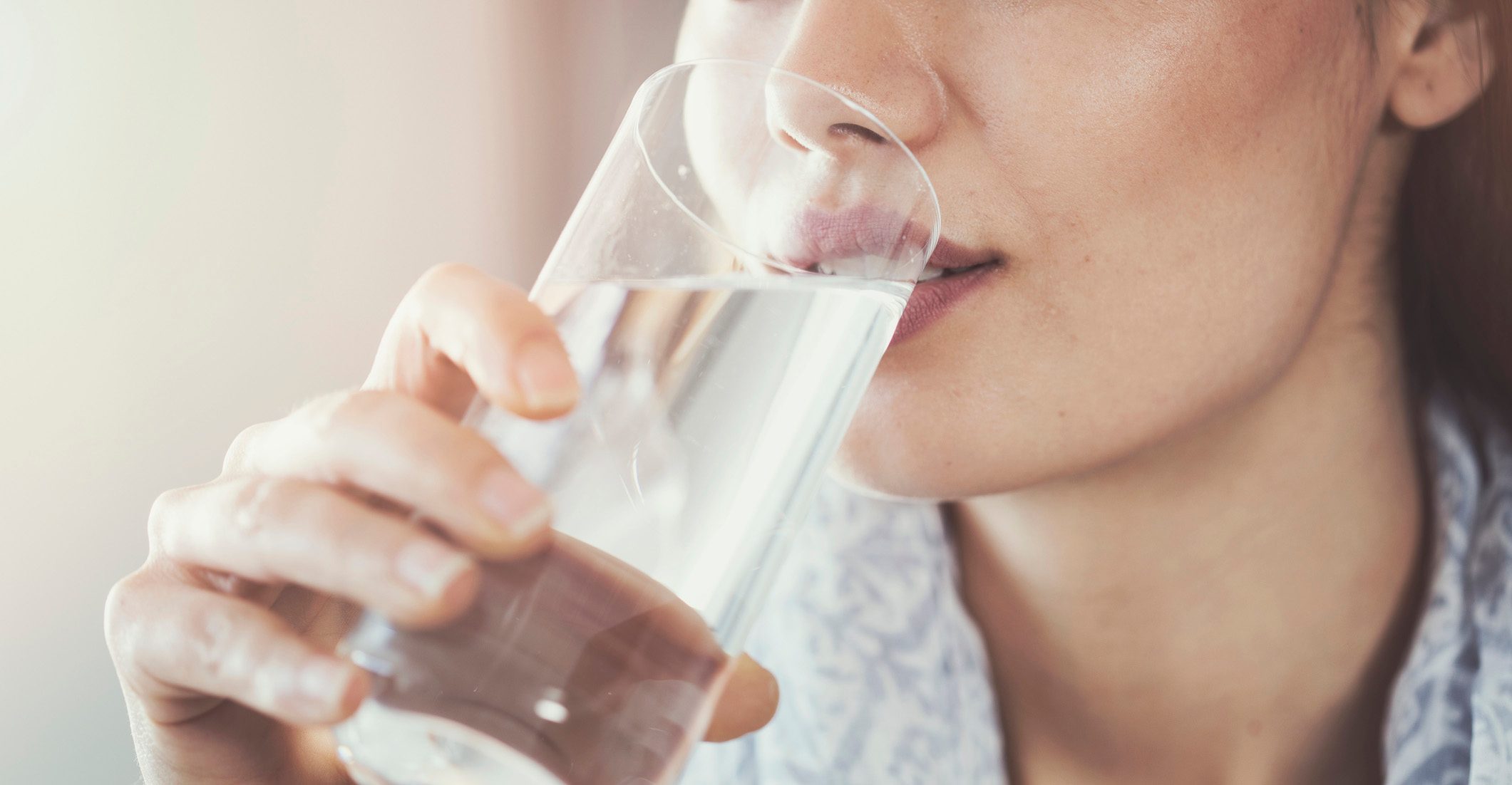 Woman drinking from a glass of water