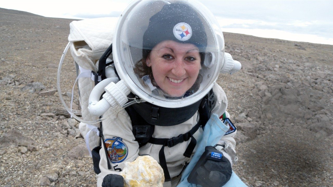 Graduate student Kristine Ferrone in her space exploration gear while researching radiation shielding and its benefits for cancer treatment