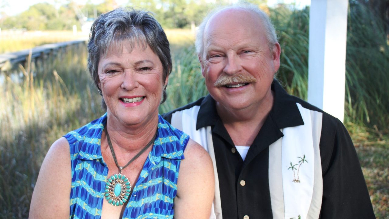 Triple-negative breast cancer survivor Robbie Johnson and her husband are all smiles, thanks to a clinical trial 