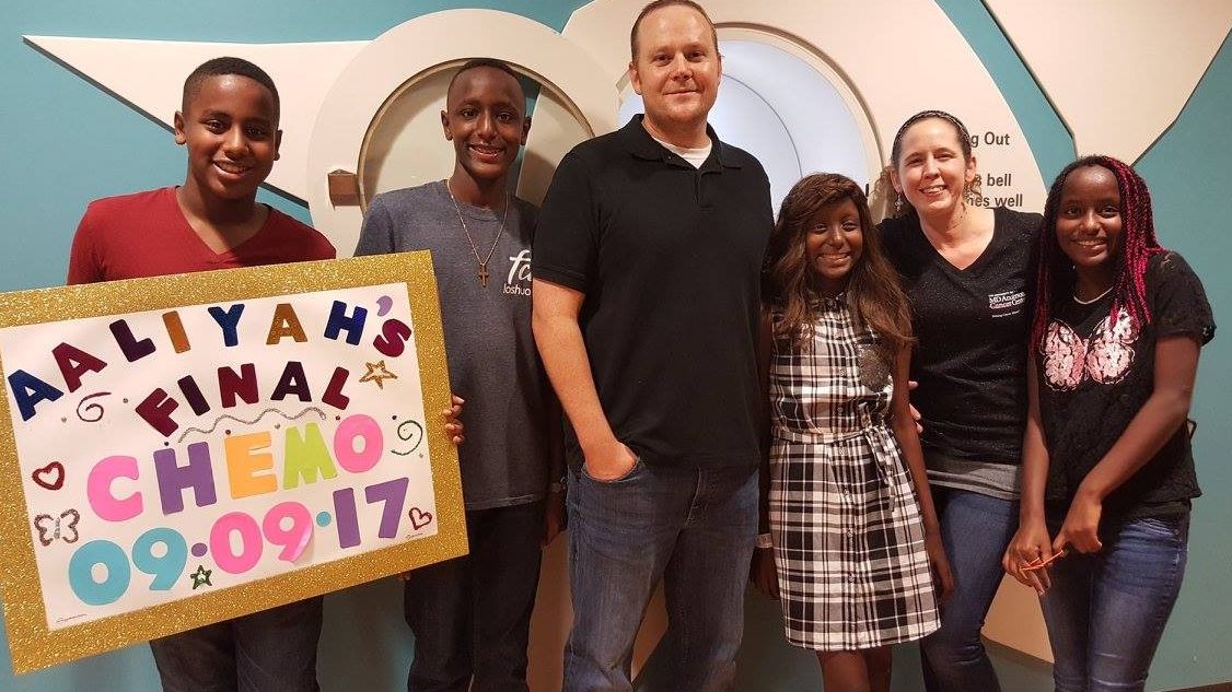 Sara Parker with her family, including daughter Aaliyah, a Ewing's sarcoma survivor, after Aaliyah's last chemotherapy treatment