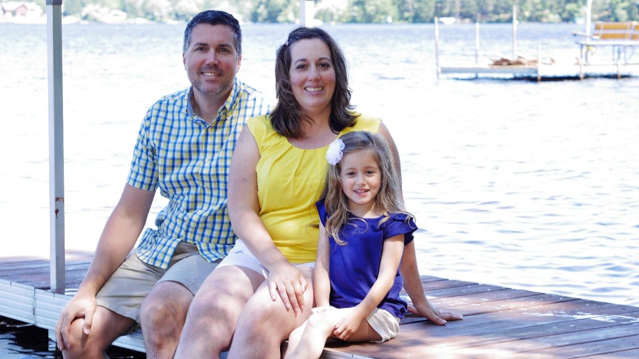 Bladder cancer survivor Keith Fox poses with wife and daughter