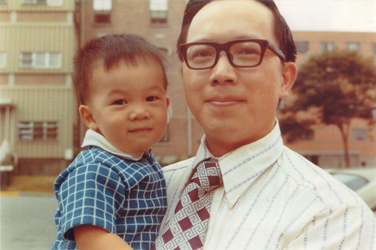 A young Stephen Lai, M.D., Ph.D., poses with his father.