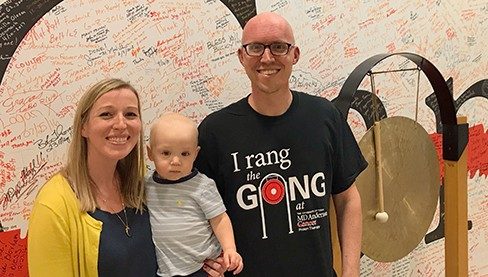 Brain cancer survivor Adam Schoen, with his wife, Claire, and son, Theo