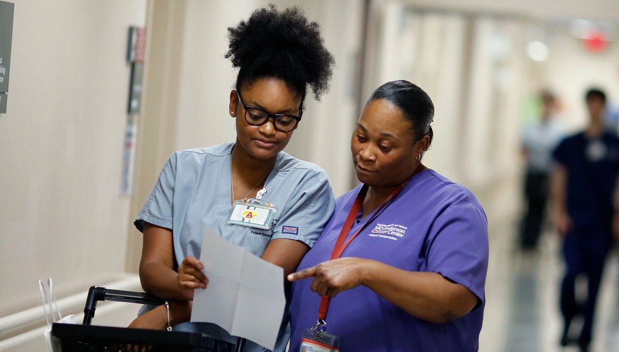 Patient escort Ti’ara Johnson and senior patient escort Deidre Frederick-Laws