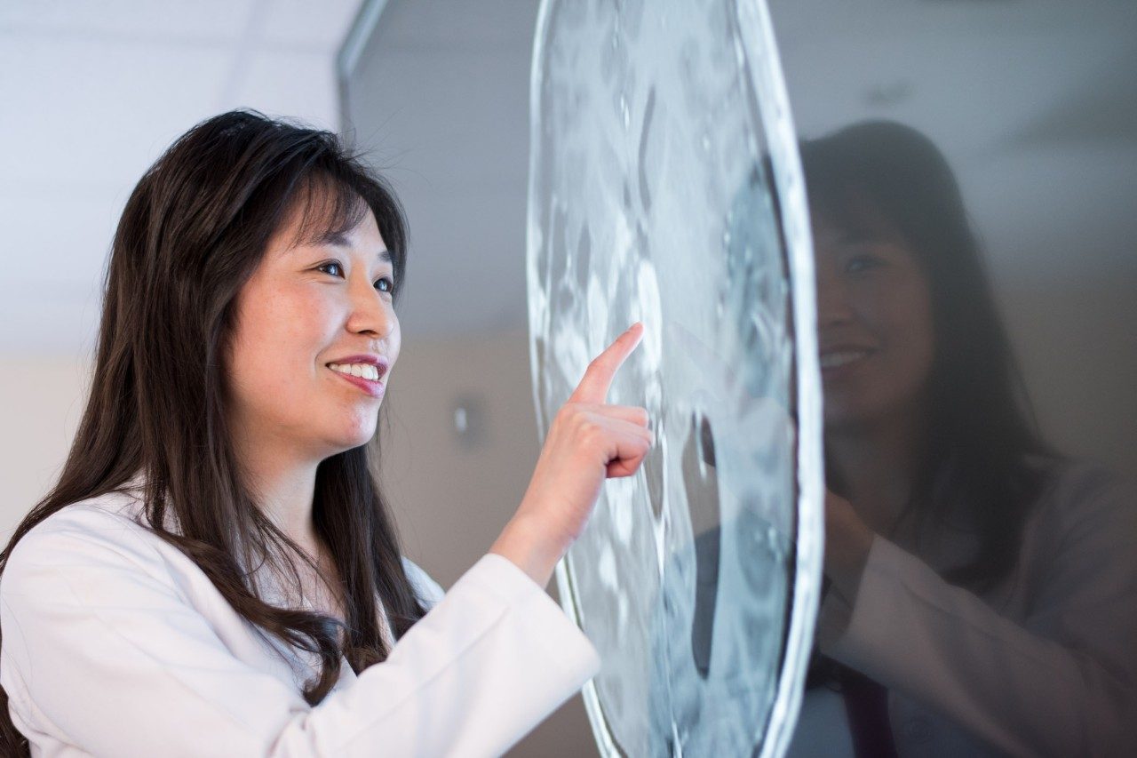 Glioblastoma expert Dr. Shiao-Pei Weathers looks at a brain scan