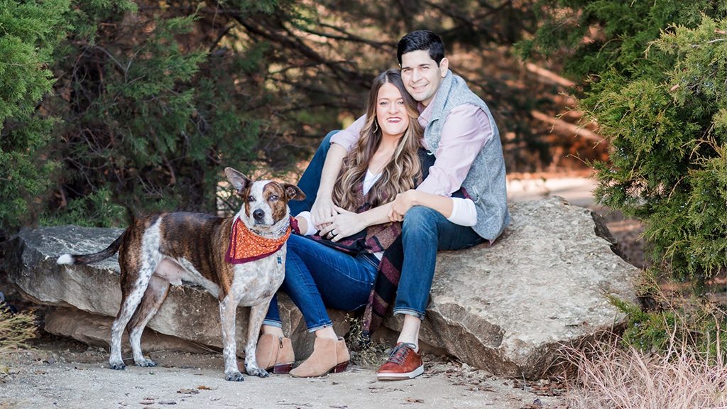 Stomach cancer survivor Santiago Salas and his wife, Natalie, pose with their dog in a park