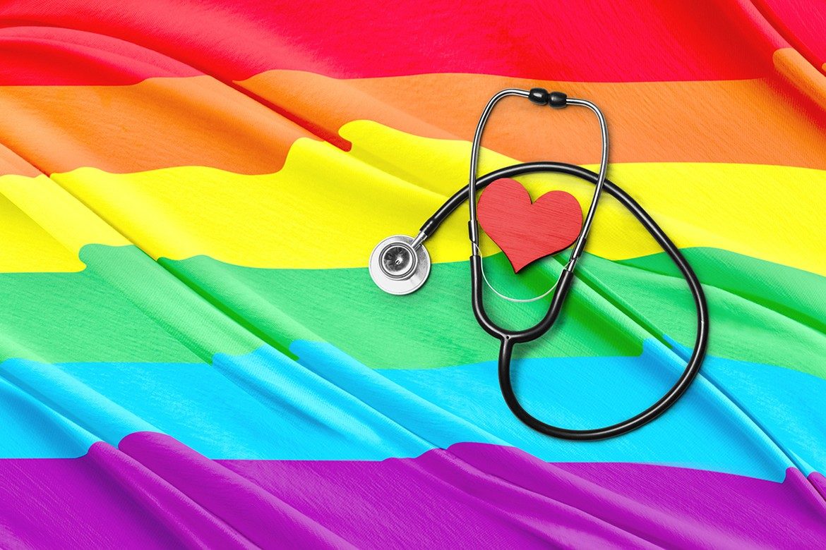 LGBTQ+ Pride flag with stethoscope and heart