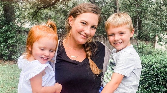 Catherine Wright holding her daughter, Ada, and son, John Michael