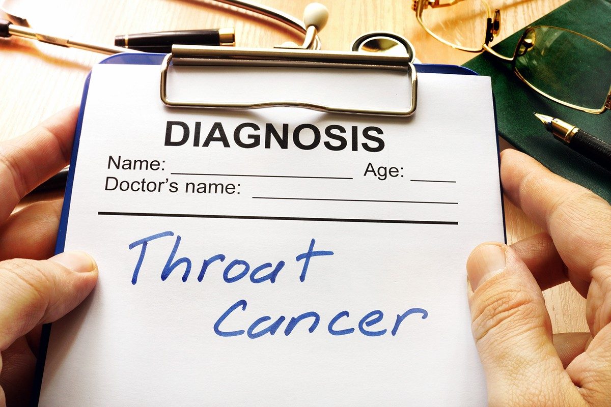 Clipboard with throat cancer diagnosis written on paper