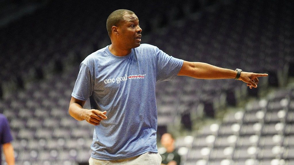 Colorectal cancer survivor Wade Mason Jr., on the basketball court