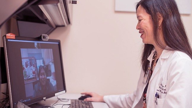 Anita Ying, M.D., conducts a telemedicine appointment with Hodgkin lymphoma patient JuanDiego Mata-Ornelas.