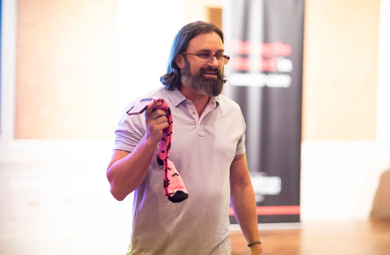Richard Bagdonas holding up pink sock.