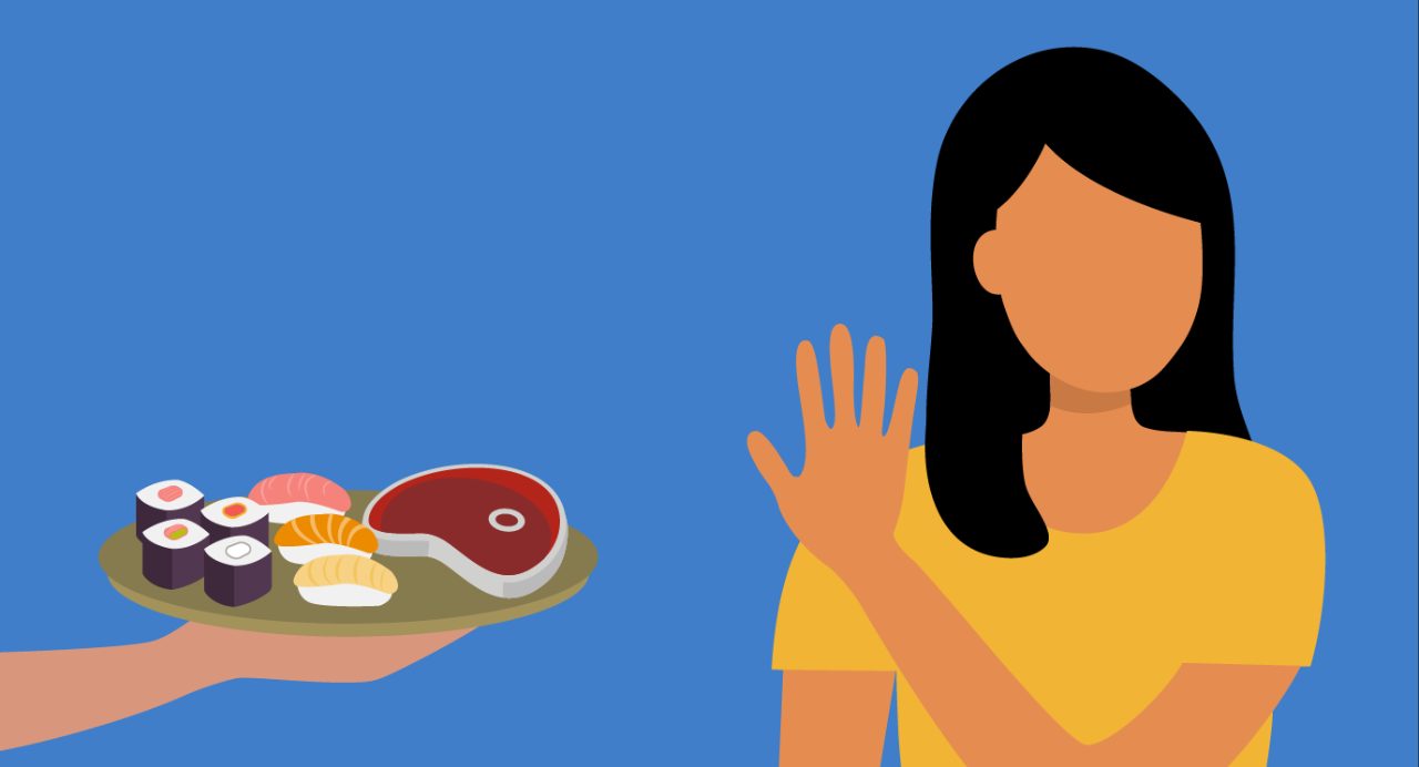 Dark-haired woman in yellow T-shirt holding up her hand in "stop" gesture to wave away plate of raw sushi and steak