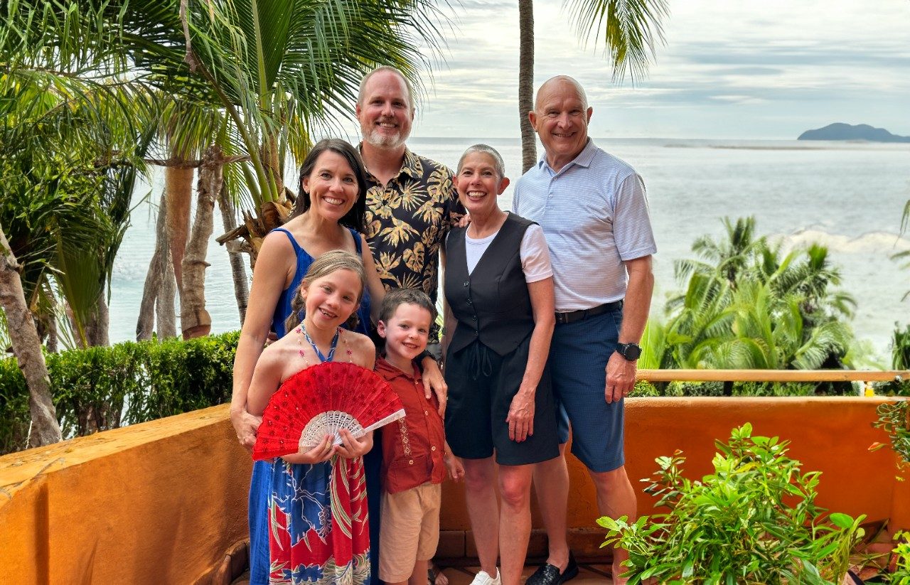 Image of J'Nan Erker with her husband, parents and children at the beach