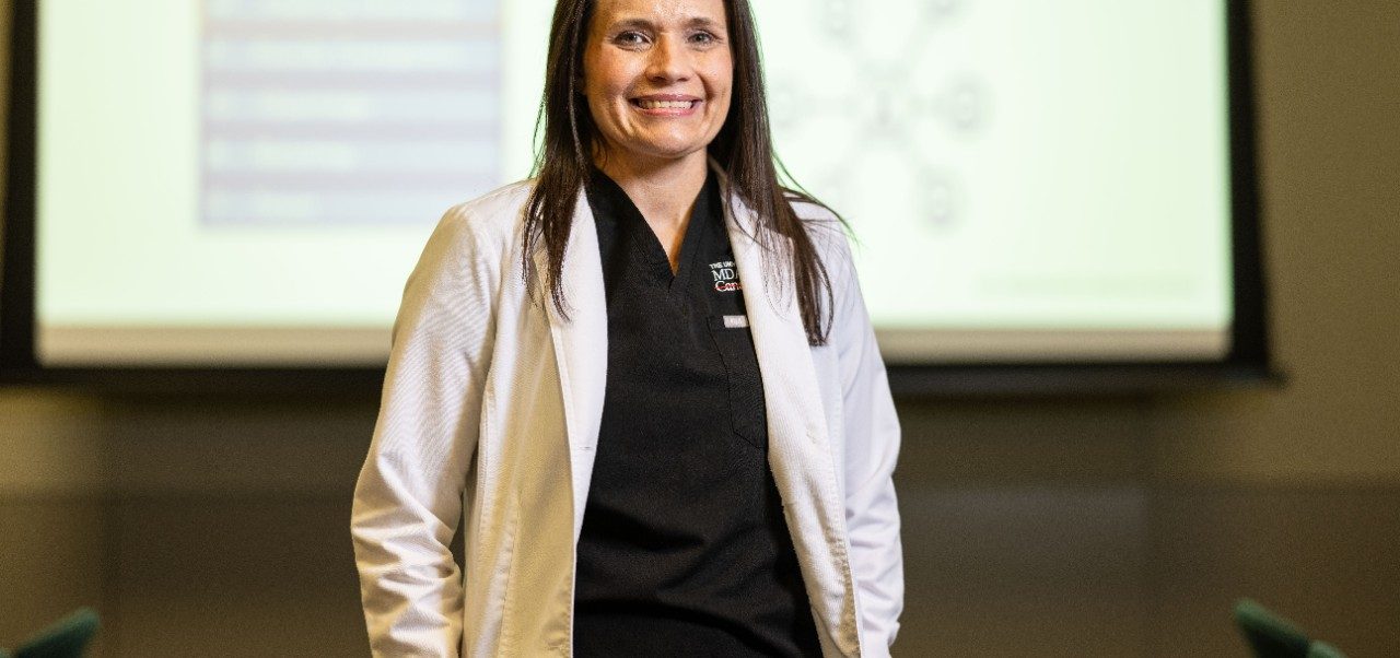 Tori McClosky stands in front of a classroom