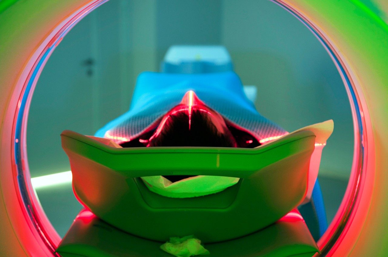 Person going through a CT scan machine