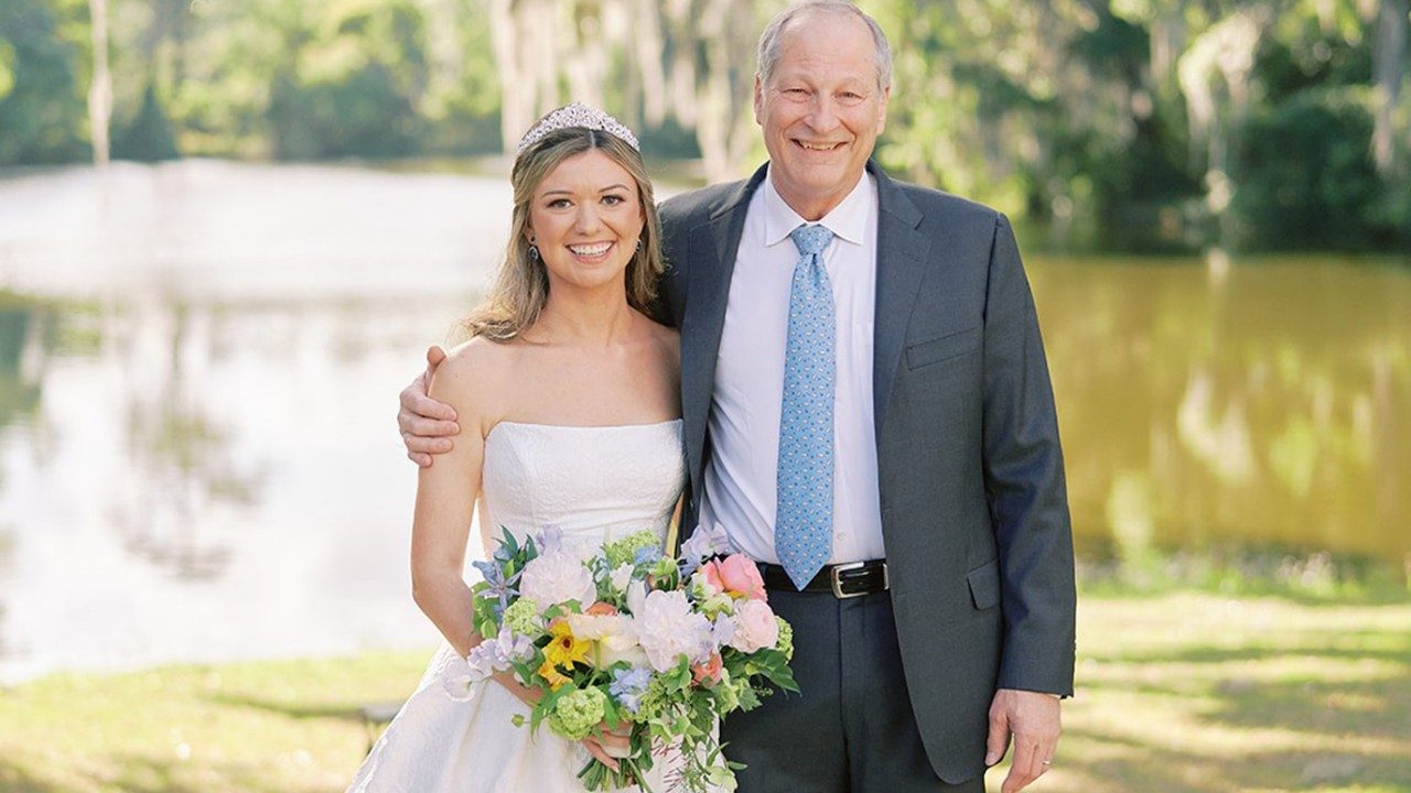 Sarah Grace Beckham poses with Paul Mansfield, M.D., on her wedding day, April 28, 2024, in Charleston, SC.