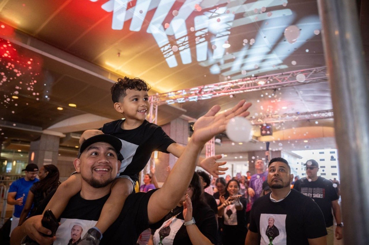 Boy on shoulders of man