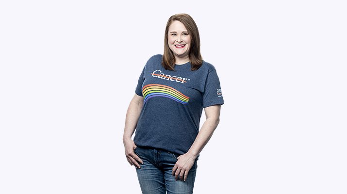 Lady wearing cancer strikethrough T-shirt with rainbow