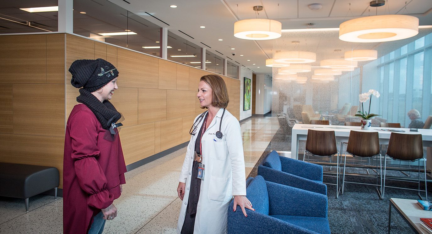 Breast cancer patient Shannon Schroeder, left, visits with nurse practitioner Jenni Hess at MD Anderson League City. 
