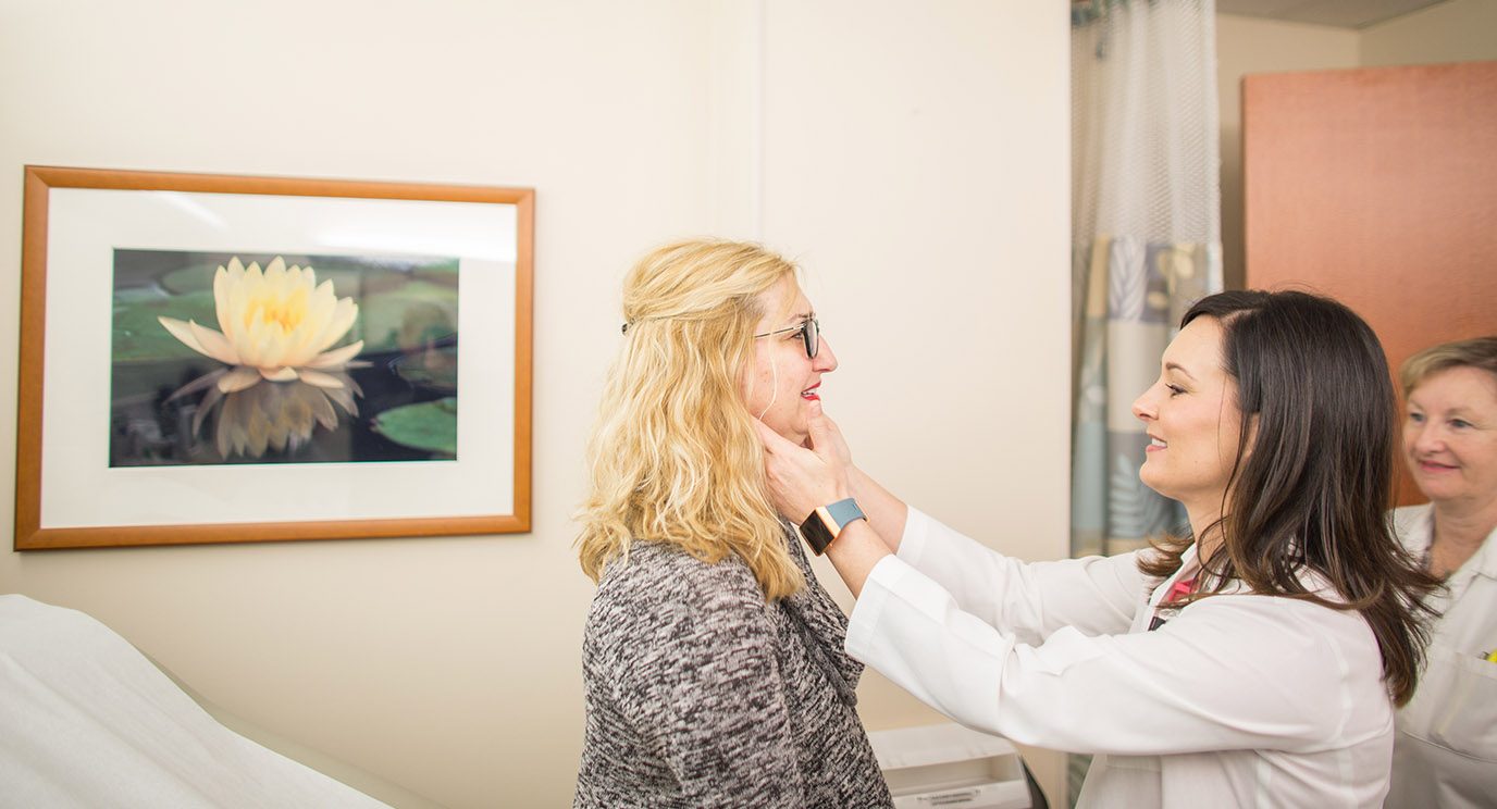 Lymphoma and myeloma expert Loretta Nastoupil, M.D., examines patient Kelly Hale.