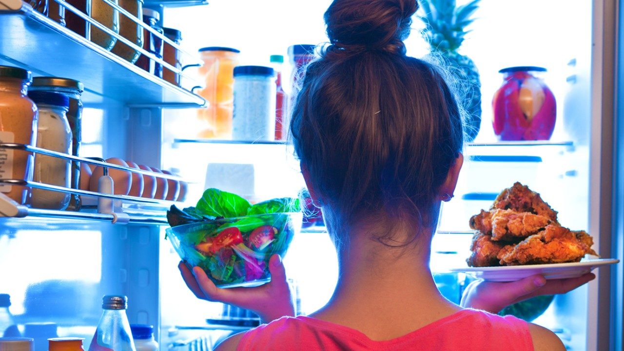 woman looking into the fridge