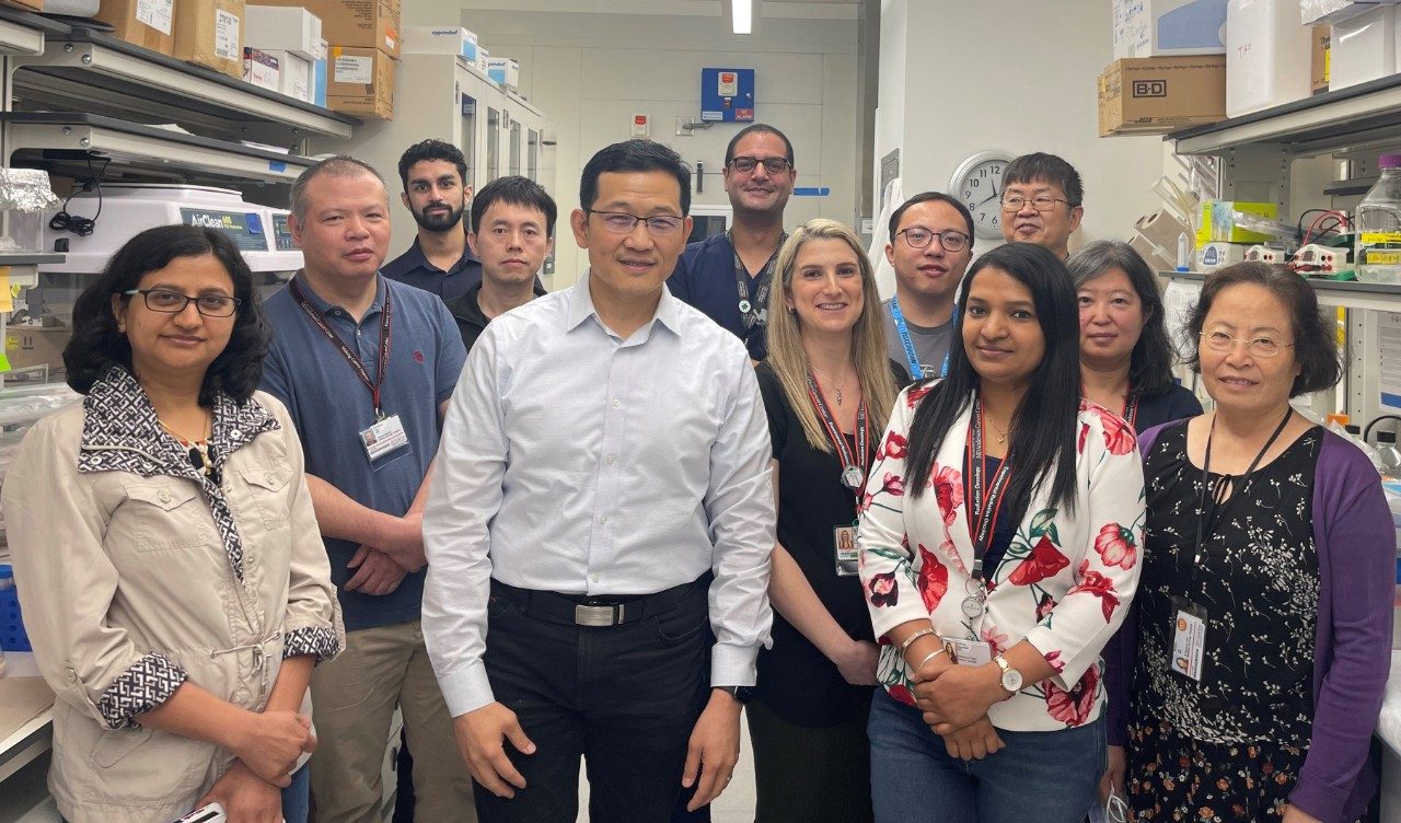 People pose in a lab