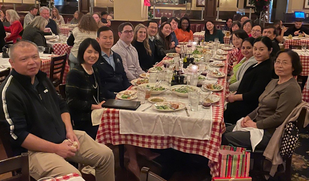 People sit around a table with food