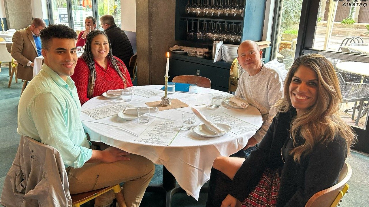 Four people around a table