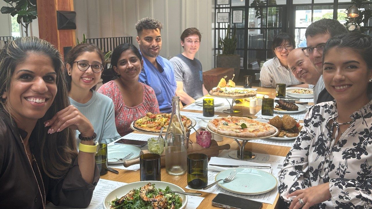 Nine people around a table