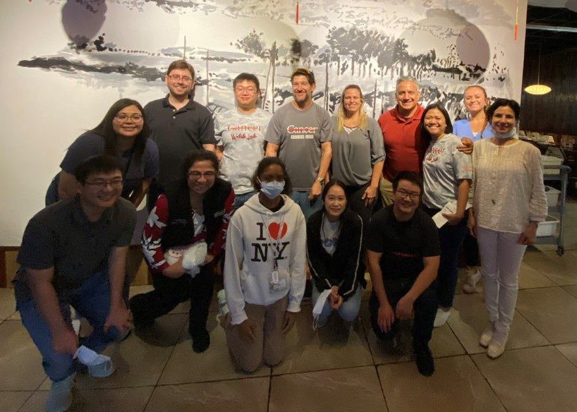 Members of the Welsh Laboratory pose inside a restaurant