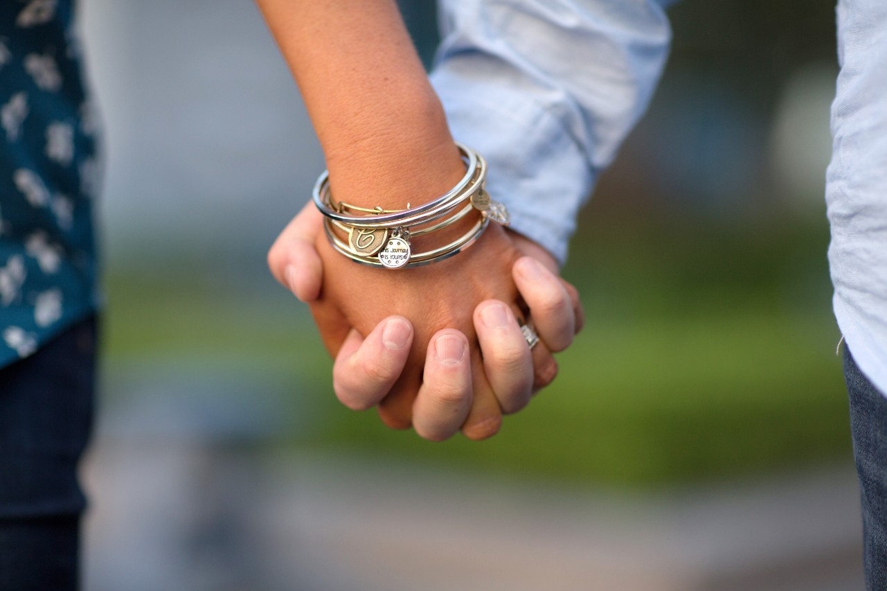 Couple holding hands